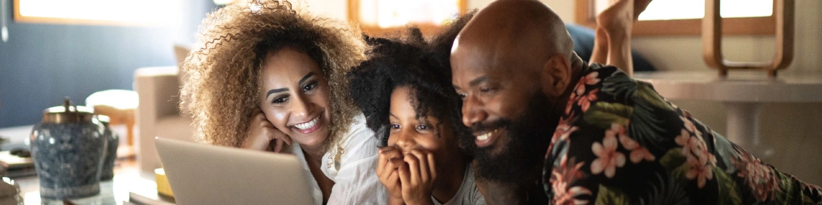family using a laptop