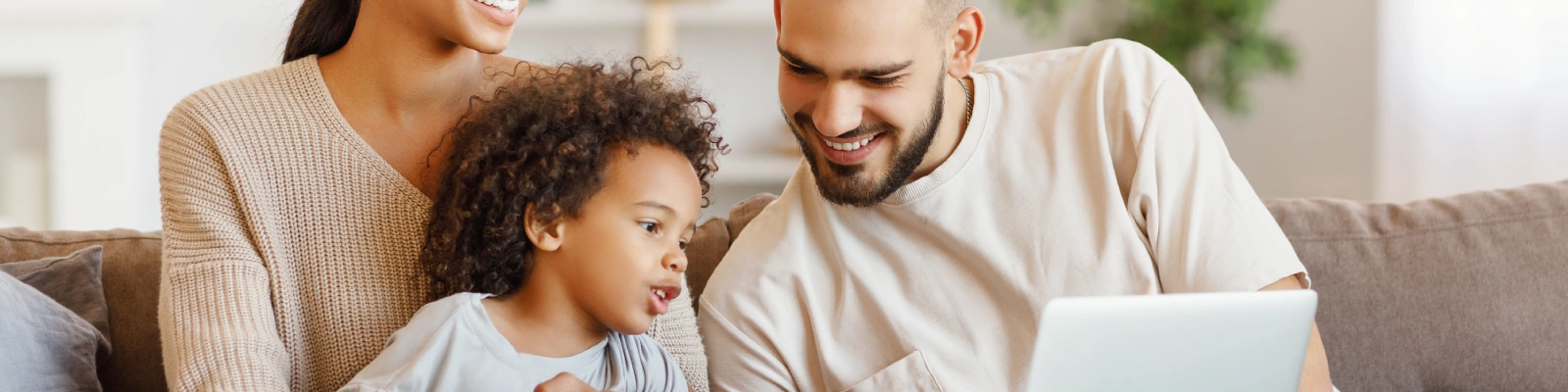 a family using a laptop