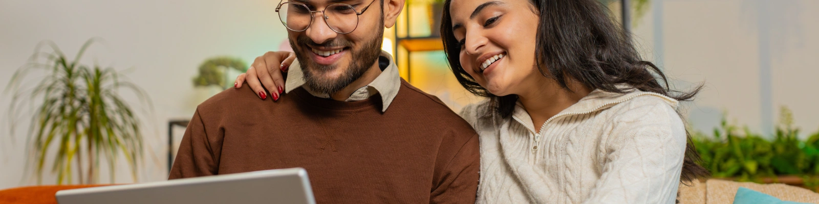 a couple using a laptop